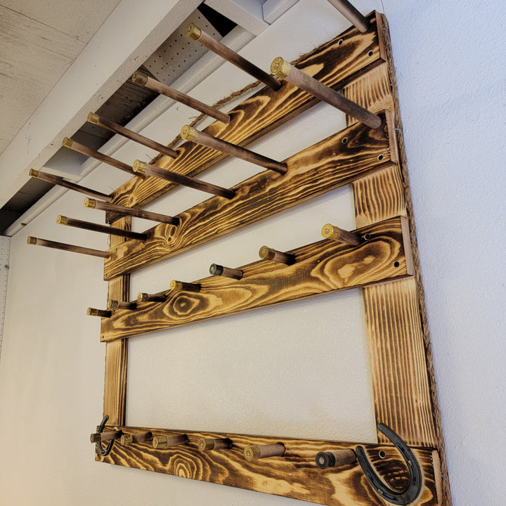 Angled view of wooden hat rack corner with multiple rails and hanging pegs