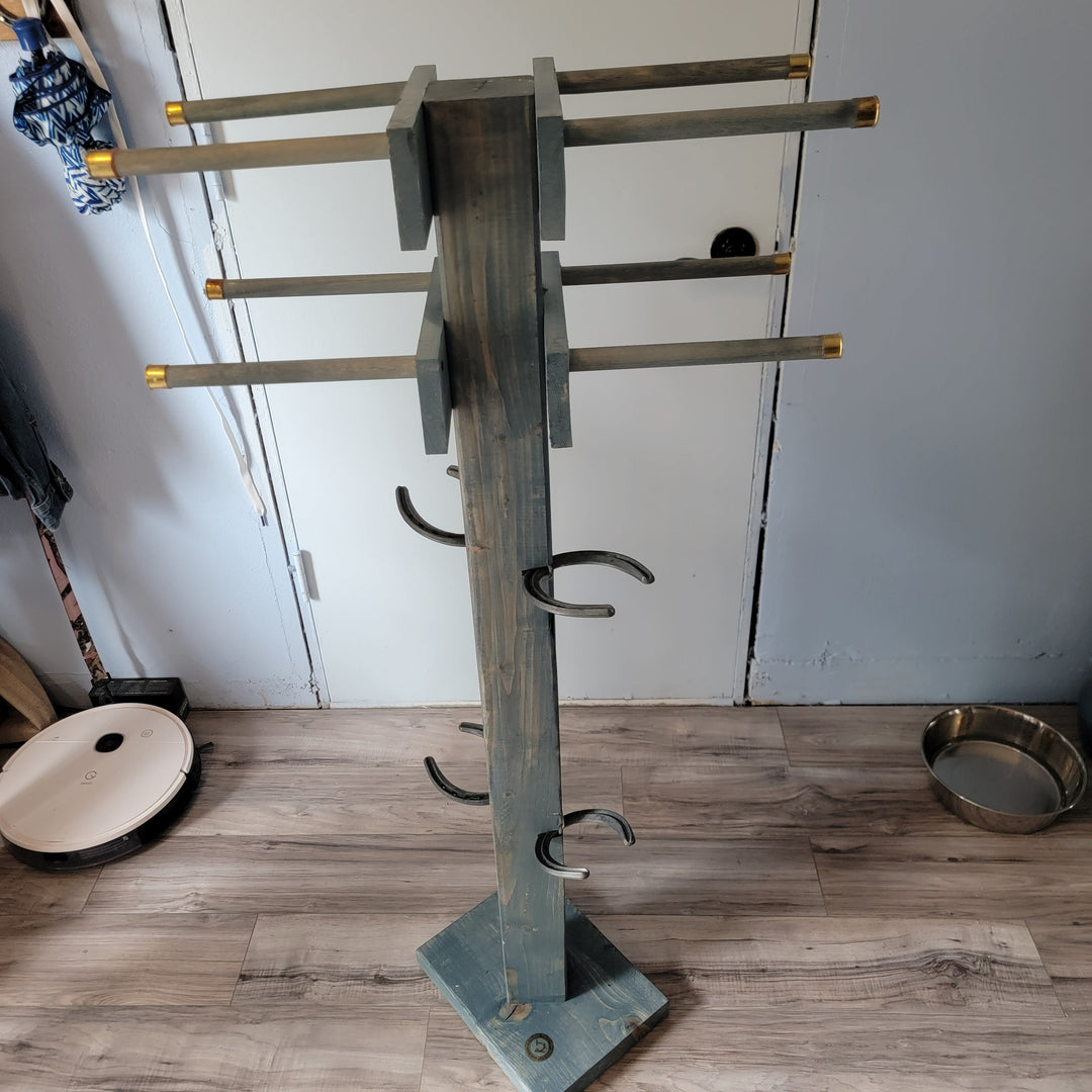 Tall wooden boot tree stand with curved metal hooks on crossbars
