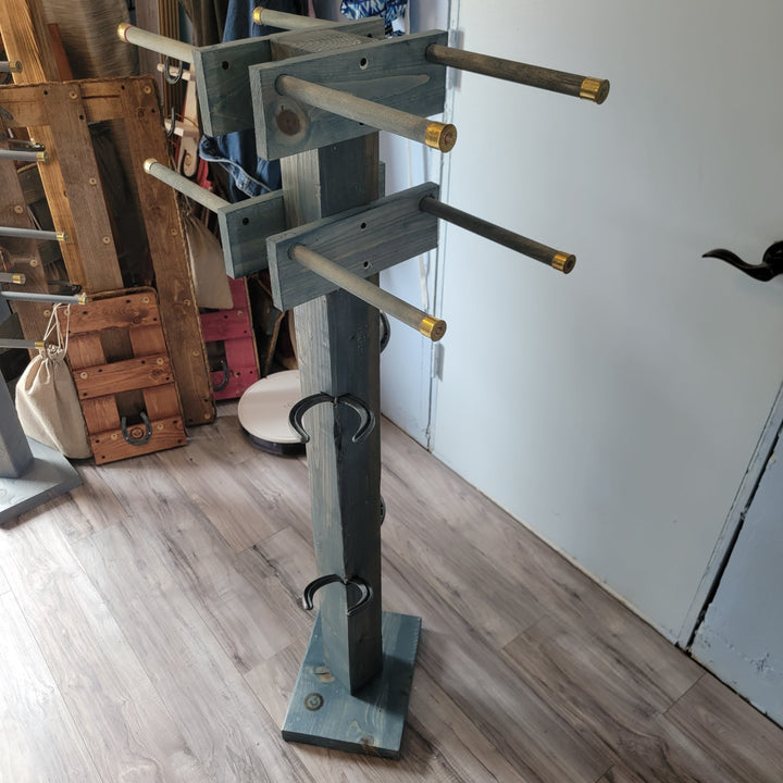 Freestanding wooden boot tree with multiple crossbars and curved metal hooks