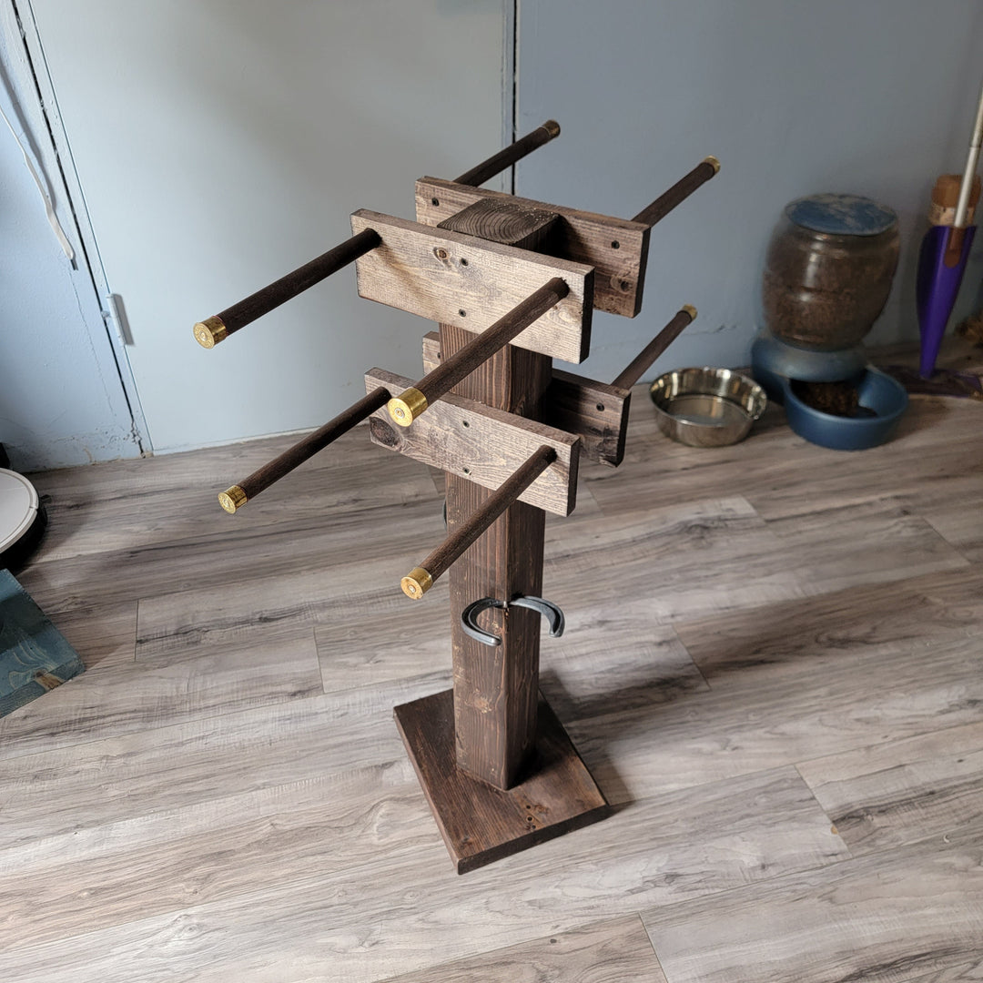 Wooden boot tree stand with multiple arms and brass tips, angled view with base
