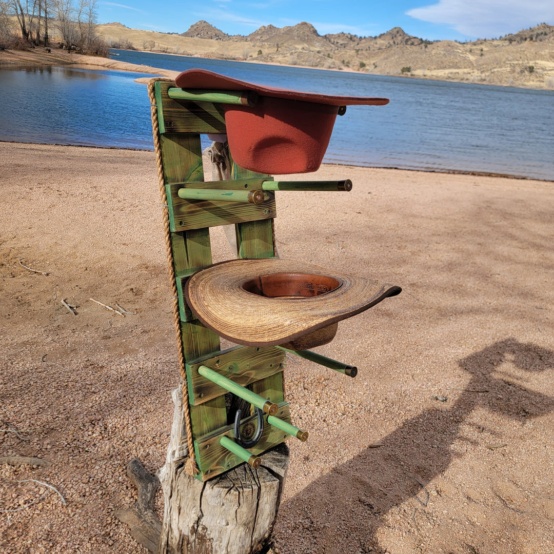 Green wooden western wall hanging organizer with hooks and hat-shaped holders