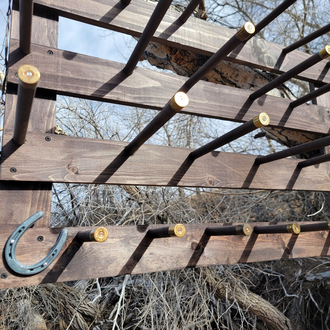 Wall-hanging hat organizer rack with peg bars and curved metal side hanger