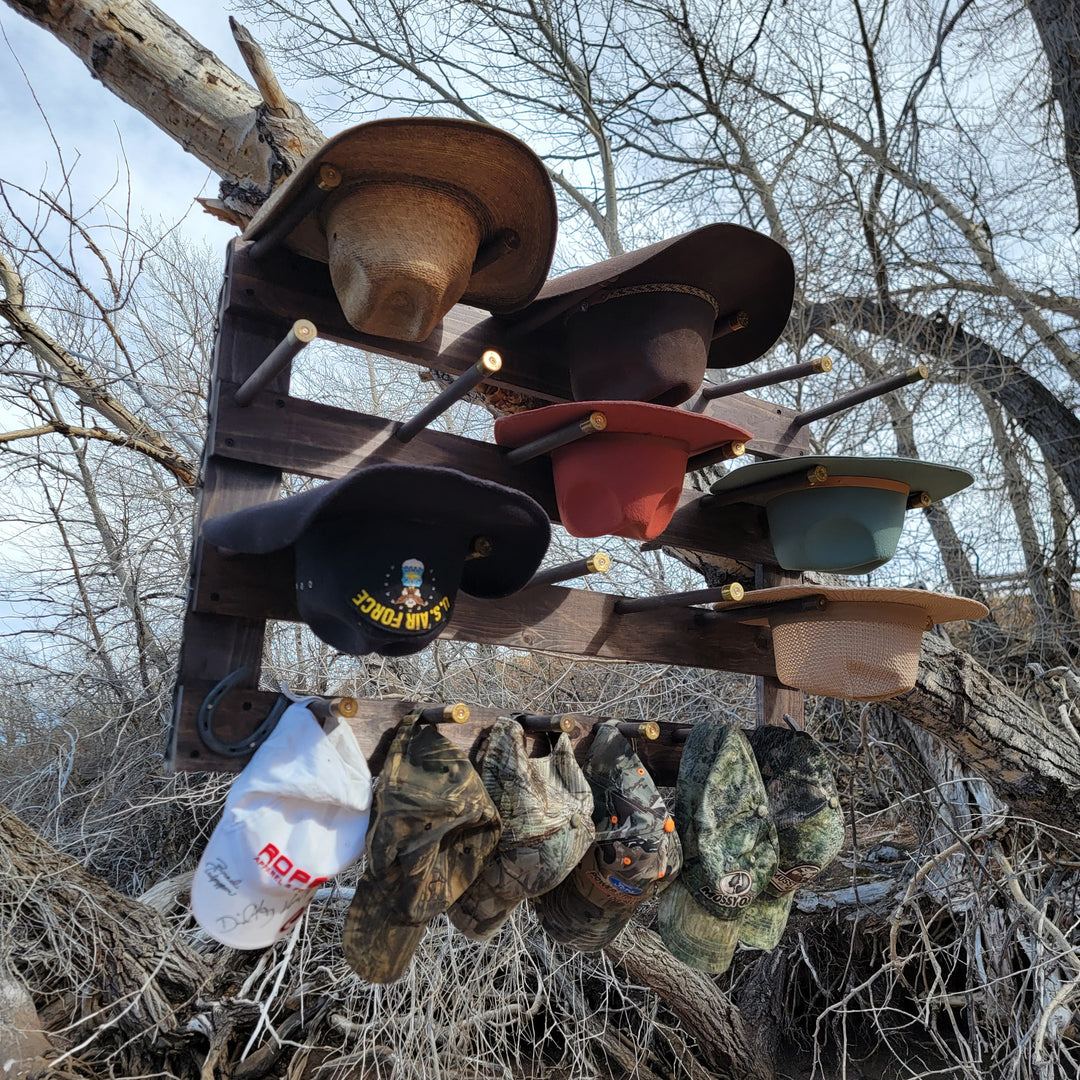 Wall-hanging hat organizer with multiple brimmed hats on horizontal wooden rails