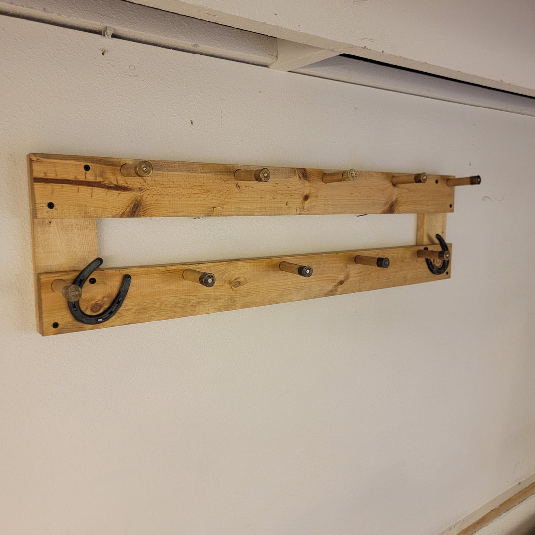 Wall-mounted coat rack with two horizontal wooden rails and curved hook hooks