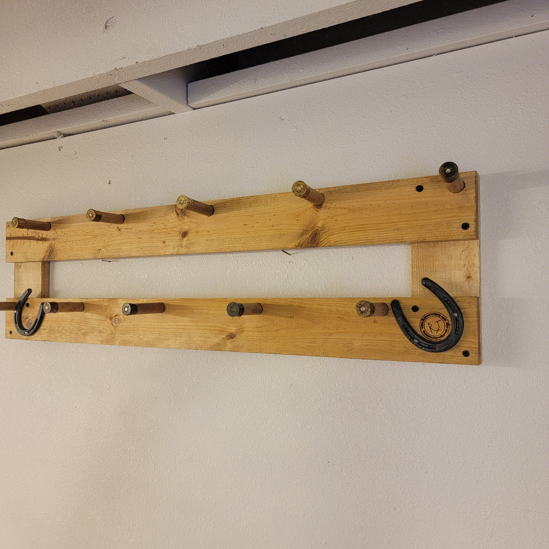 Wall-mounted two-level coat rack with curved metal hooks and small pegs