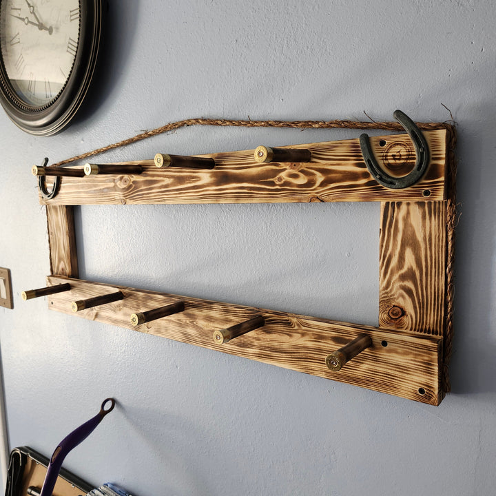 Wall-mounted heritage coat rack with two rows of hooks on a wooden frame