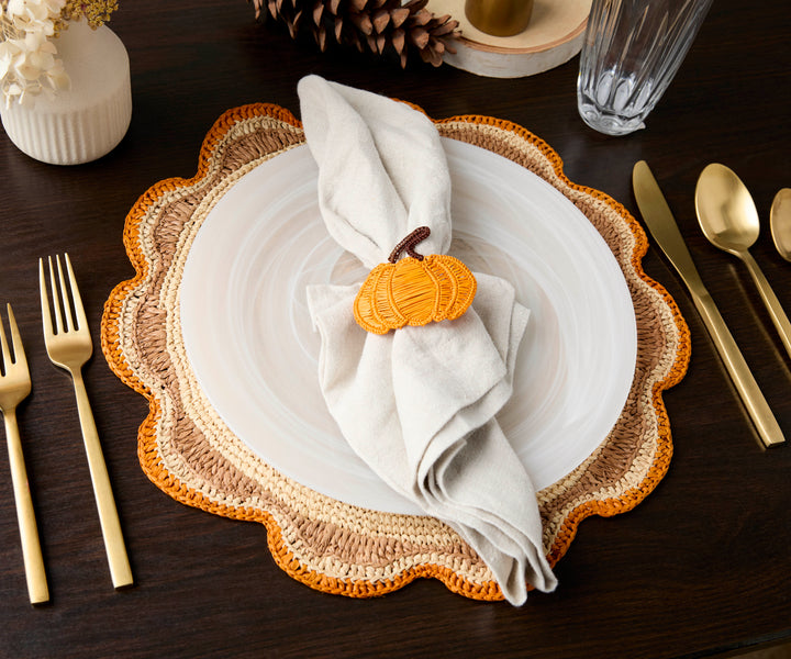 A handwoven Raffia Placemat in Tan, Orange & Brown