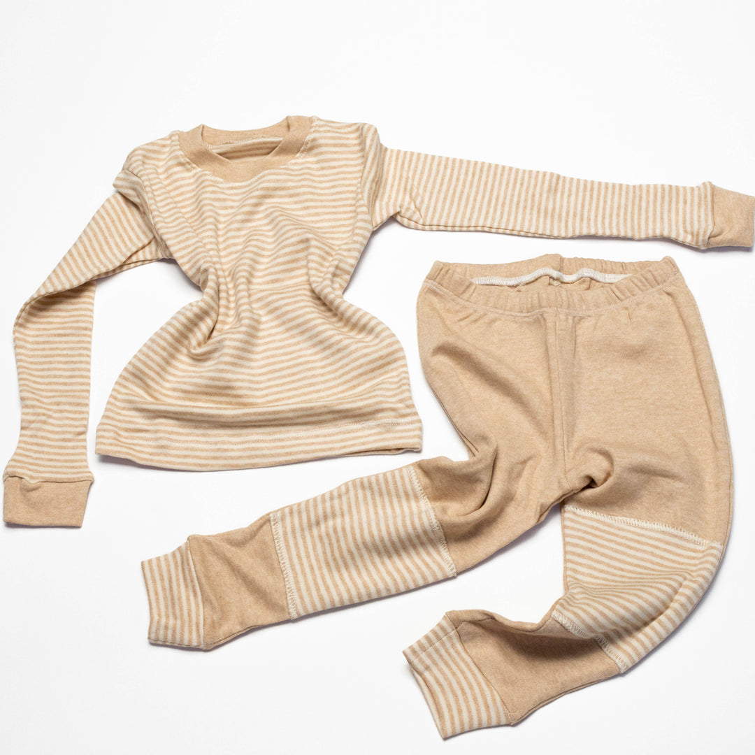 Baby pajama set laid flat: striped long-sleeve shirt with round neckline and striped pants