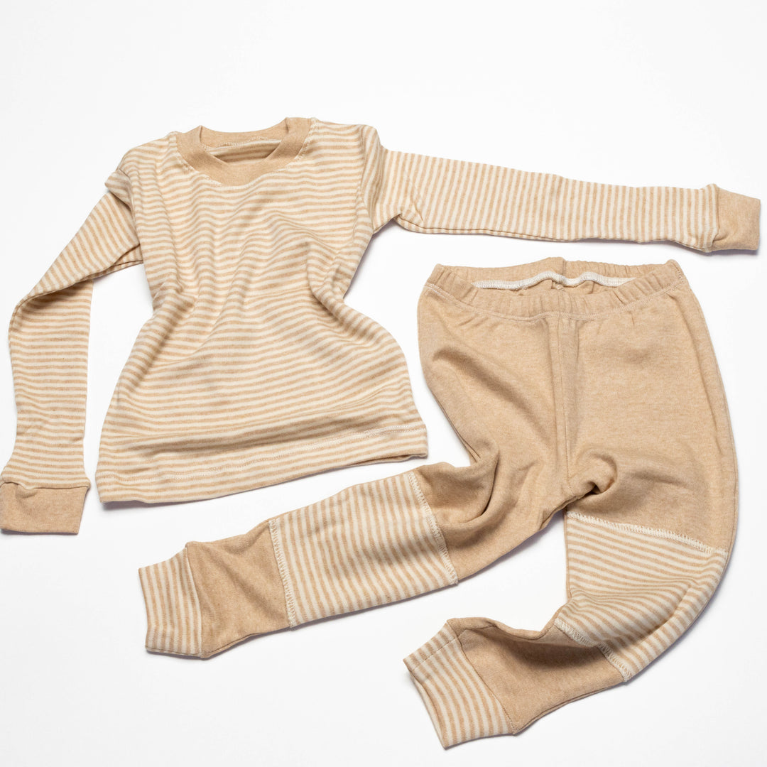 Baby pajama set flat view: long-sleeve orange-and-beige striped top with matching pants