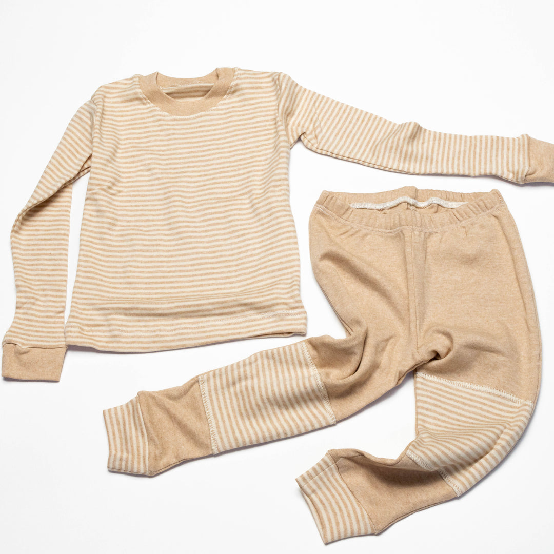 Baby pajama set laid flat: striped long-sleeve top plus beige striped cuffs on jogger pants
