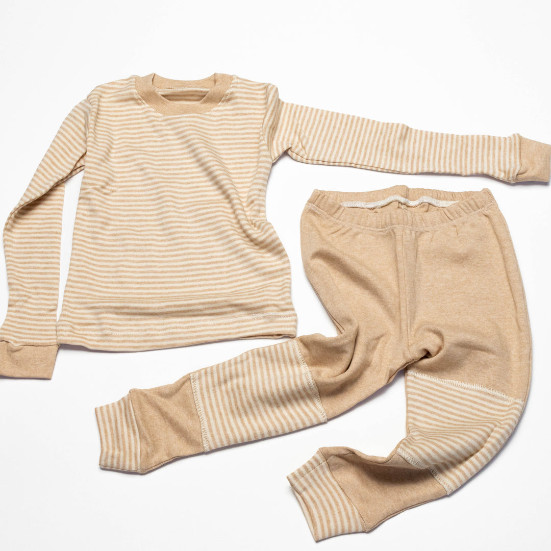 Baby pajama set overhead: long-sleeve striped shirt with matching striped pants and cuffs
