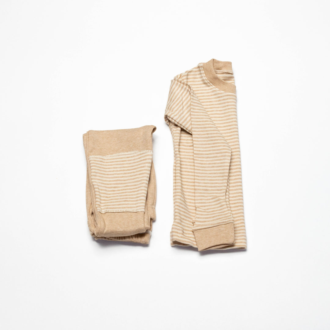 Baby pajama set with long-sleeve striped top and matching beige pants, cuffed hems and orange stripes