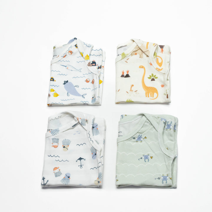 Toddler undershirt tops 4-pack, folded, with ocean and dinosaur-like animal patterns