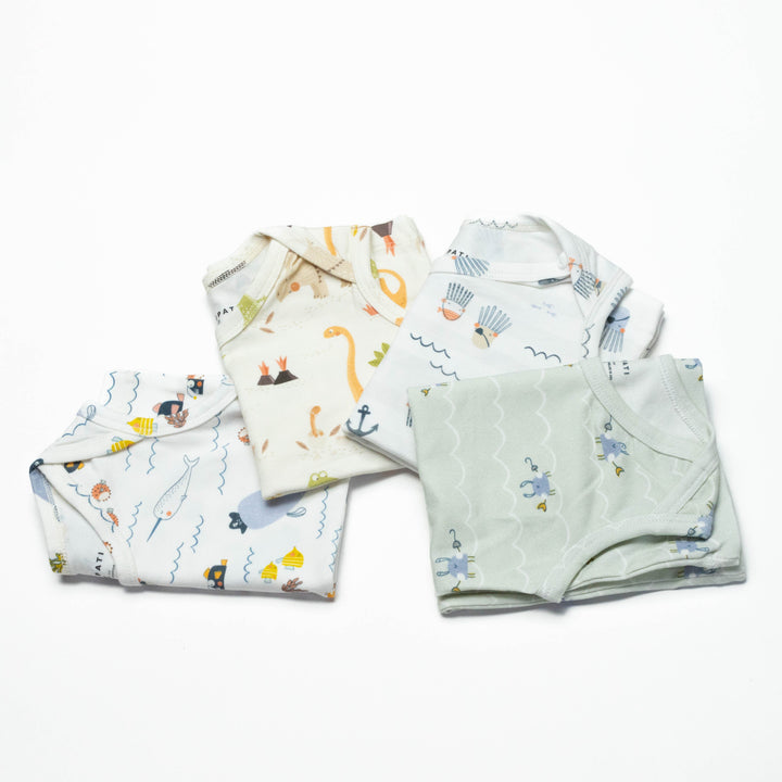 Toddler undershirt tops 4-pack, folded, showing overlapping sea animal and cloud prints