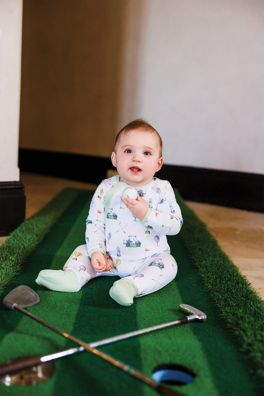 Baby organic cotton pajama set in white with colorful vehicle and trophy prints