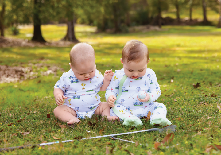 Baby two-piece pajama set in white with colorful vehicle and trophy prints, long sleeves