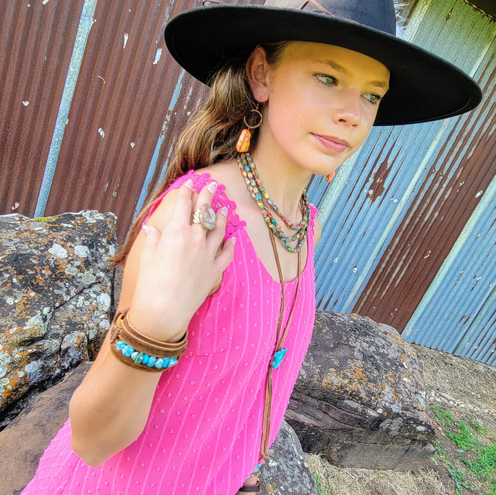 Triple-strand beaded boho necklace with multicolor beads and turquoise center pendant