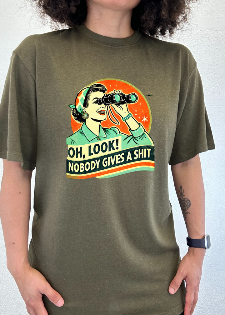 Olive unisex graphic T-shirt with retro woman holding binoculars.