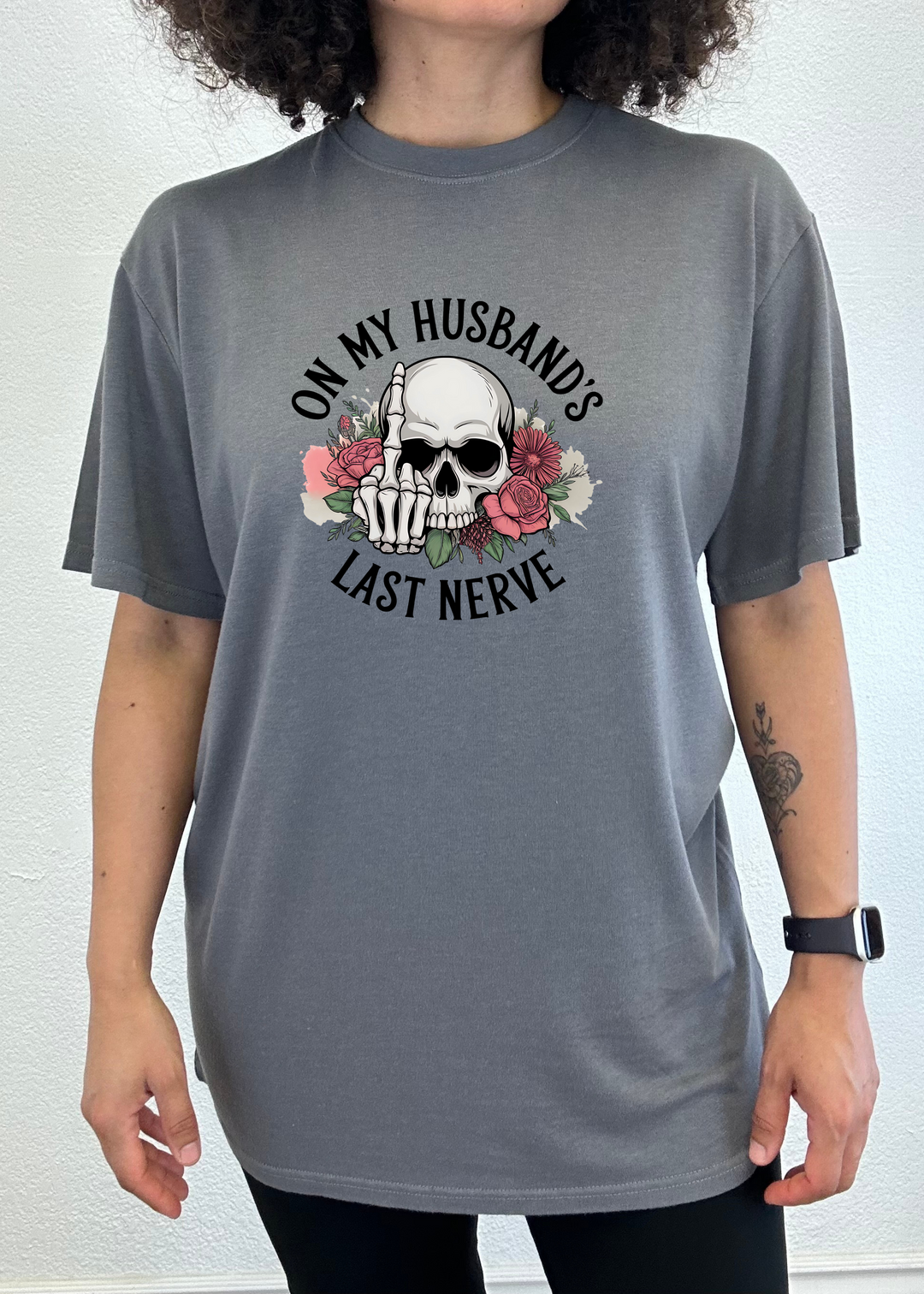 Dark gray unisex graphic t-shirt with skull, roses, and &