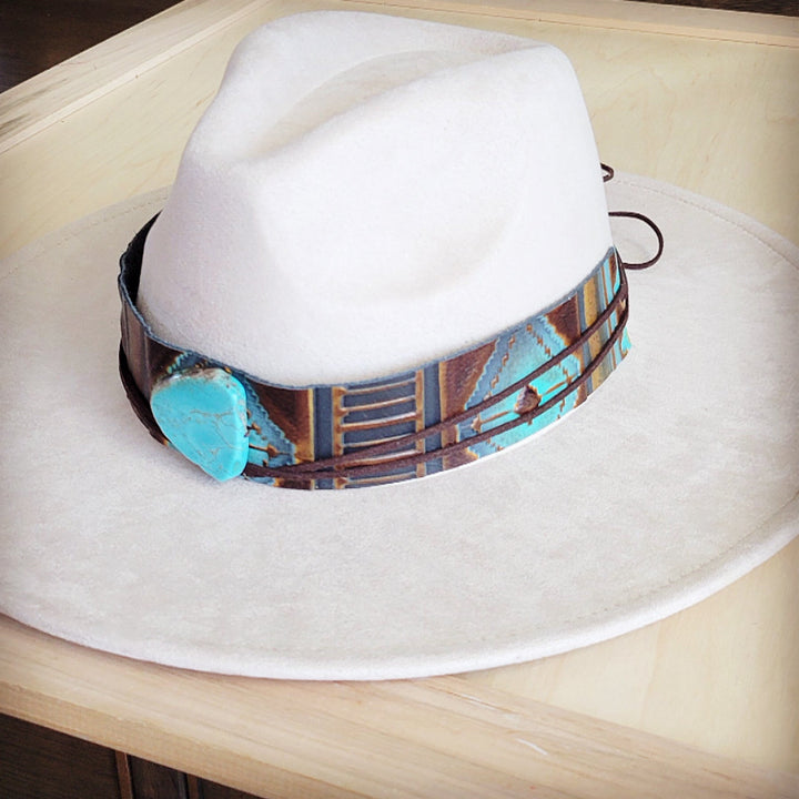 White felt wide-brim hat with wide patterned leather hat band and turquoise stone
