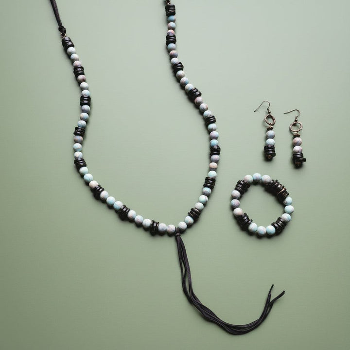Stretch beaded bracelet with frosted aqua/white beads and black spacers, elastic