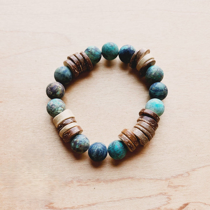 Turquoise stone-look bead stretch bracelet with dark blue highlights and wood barrel beads