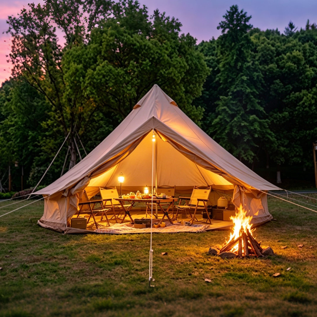 Beige bell tent with warm interior lights and a fire pit near the entrance