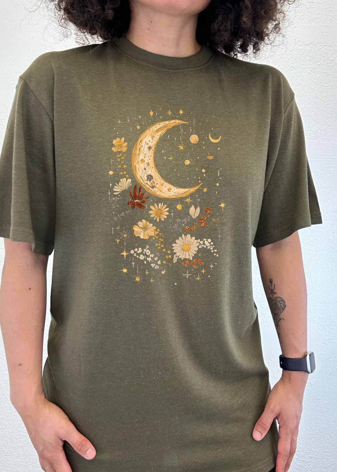 Unisex graphic T-shirt in olive green with gold crescent moon and floral print.