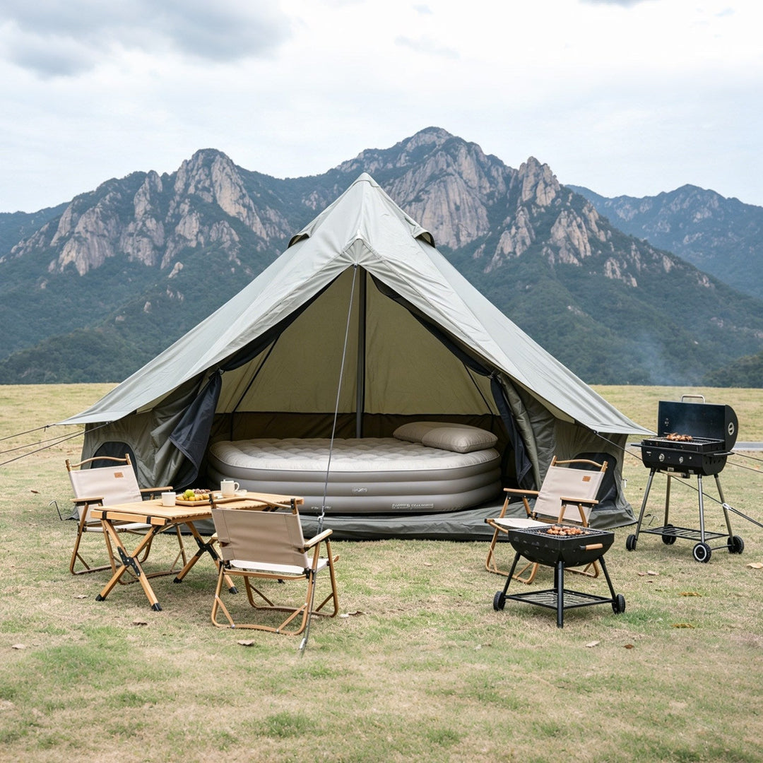 Oxford bell tent with light beige rainfly and dark interior, includes stove and seating.