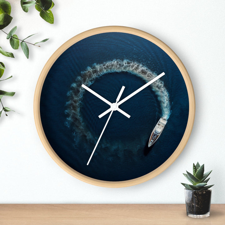 Round wall clock with blue nautical artwork, wooden rim, white clock hands