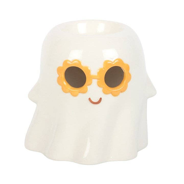 White ghost wax warmer front view with orange flower glasses and smile.