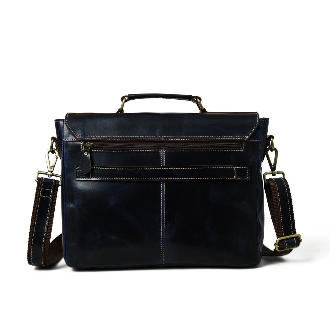 Dark blue laptop messenger bag back view with flap, buckles, and stitched panels