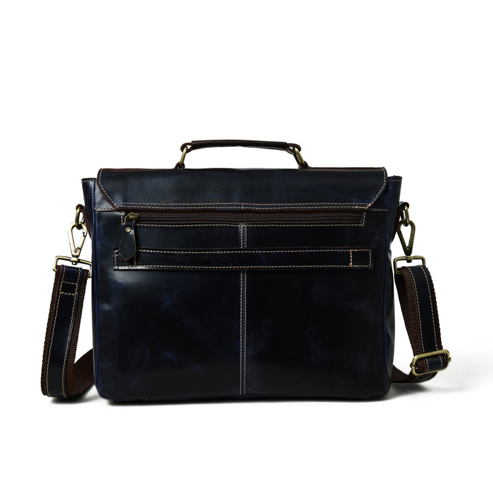 Dark blue laptop messenger bag back view with flap, buckles, and stitched panels