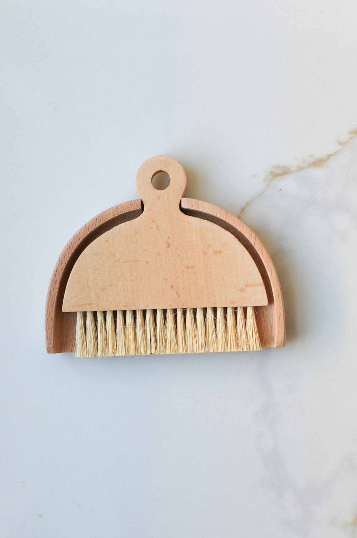 Wood table brush with loop handle and tan bristle head, light wood finish