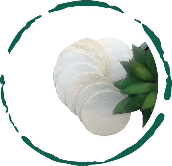 Natural loofah facial pads, round and textured, with a leaf accent