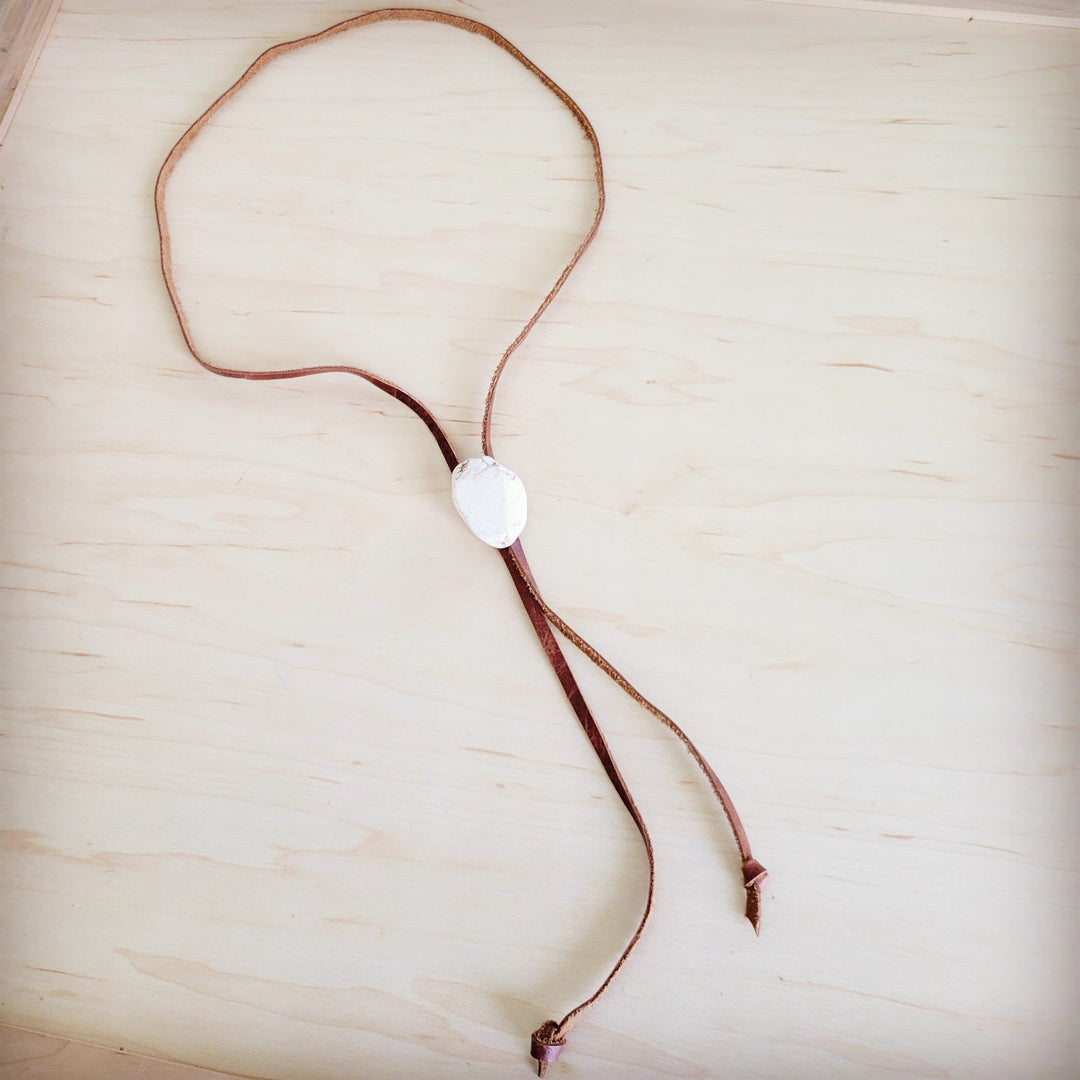 Leather lariat necklace featuring a white oval turquoise slab pendant with two ties