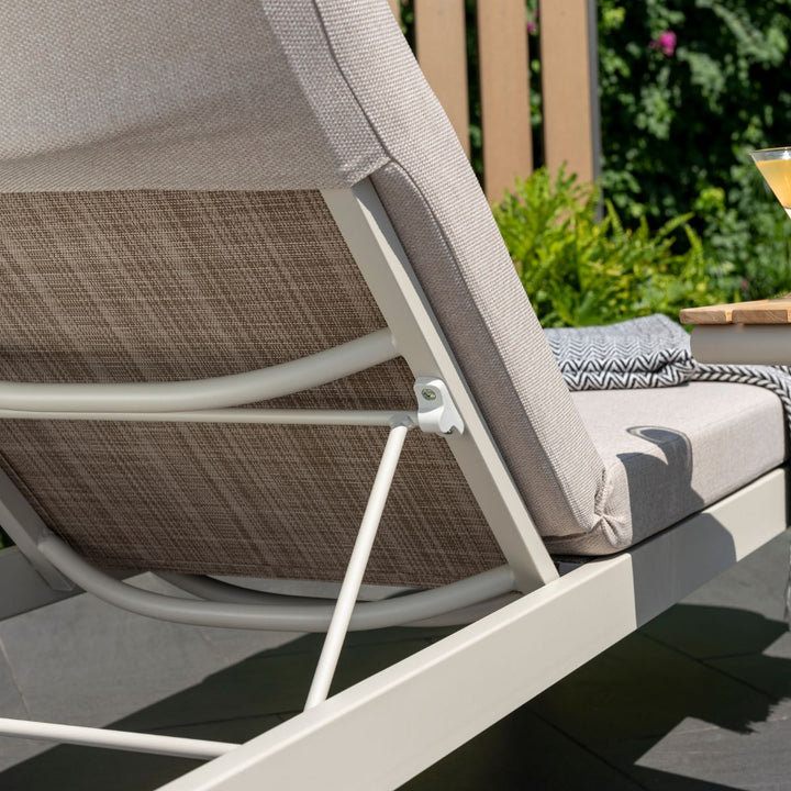 Light beige sun lounger backrest with fabric strap and white metal support frame