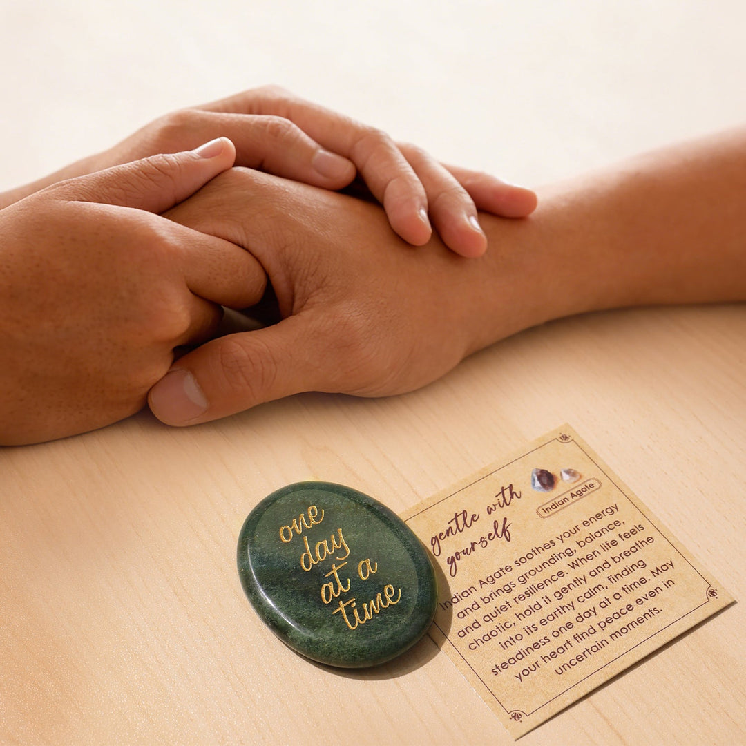 Green oval pocket crystal stone with gold “one day at a time” text