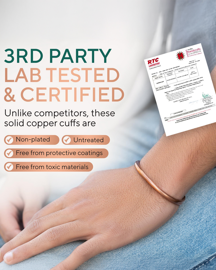 Rose-gold copper cuff bracelet on wrist with certification document nearby