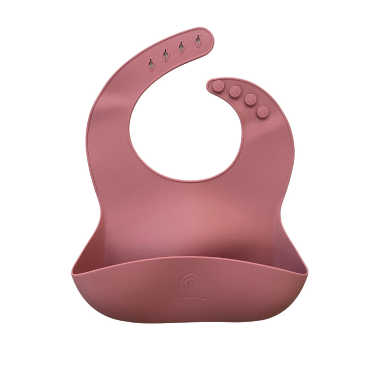 Rose pink silicone bucket bib with crumb catcher and snap buttons detail