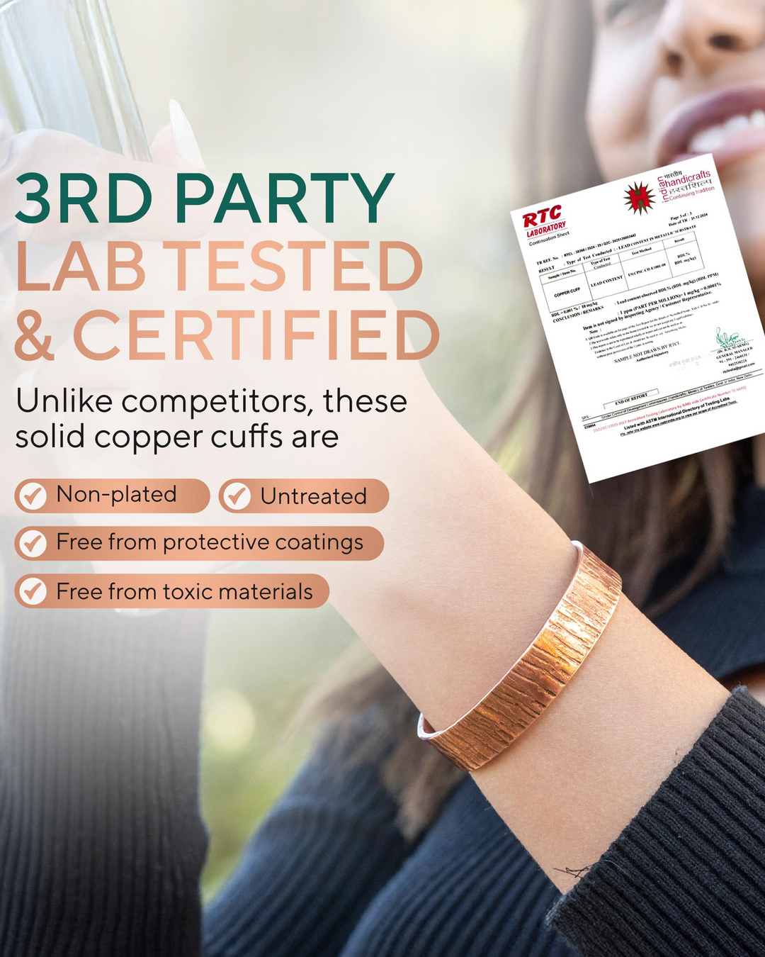 Copper cuff bracelet worn on wrist, hammered texture with wide band.