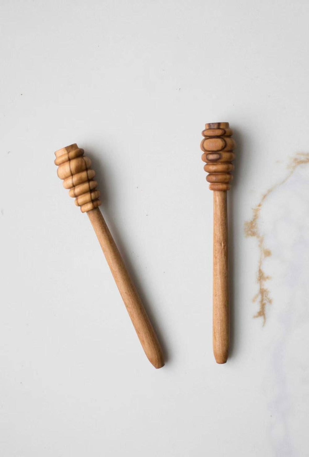 Olive wood honey dipper pair with stacked ridged scoop tips, straight handles