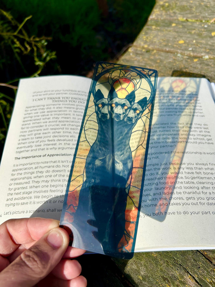 Fantasy bookmark with blue three-headed dog skull design in ornate frame