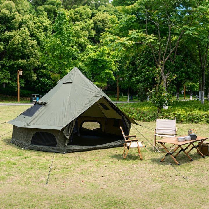 Light gray bell glamping tent with dark trim, arched window cutout, open front