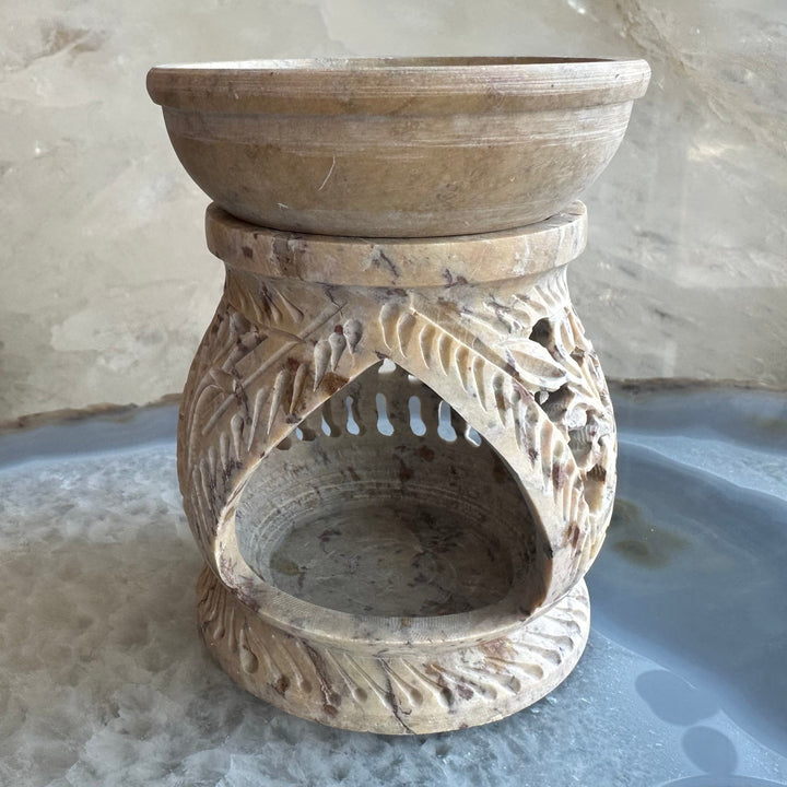 Carved soapstone essential oil burner with oval open bowl and drip-style cutouts