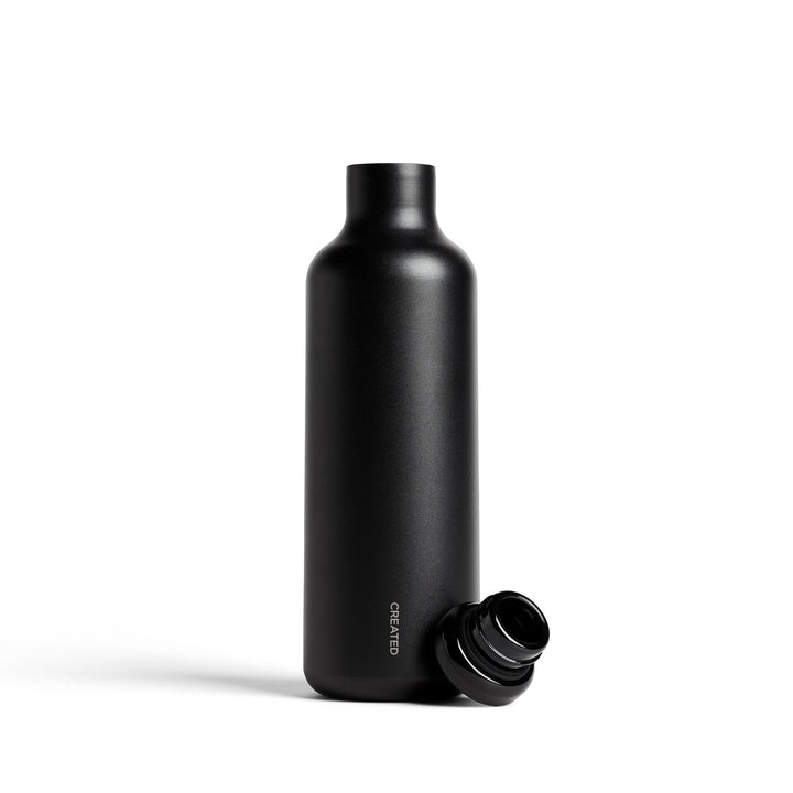 Black wine carafe with removable screw-top cap, side view