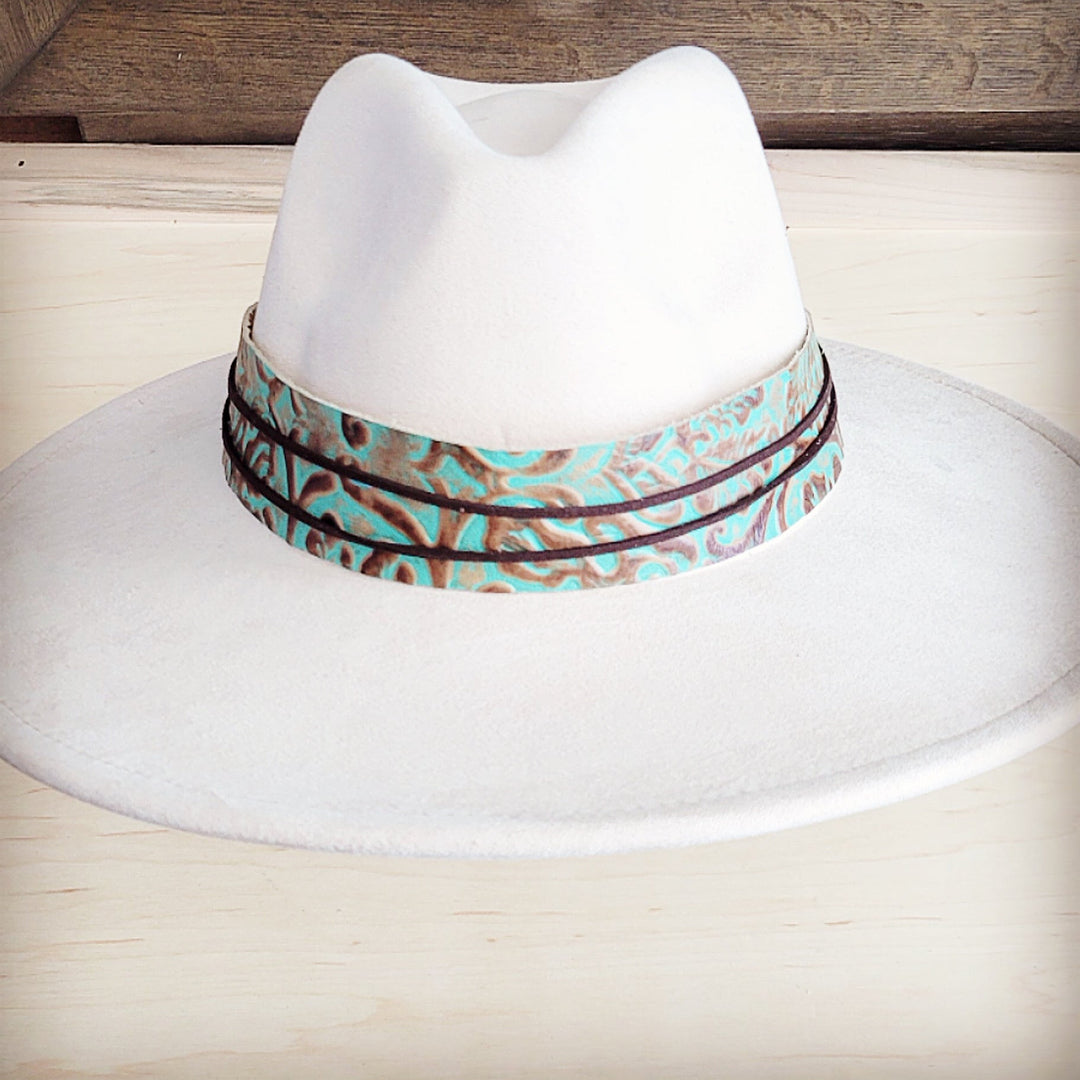 Turquoise leather cowboy hat band with embossed swirl design and dark edge bands