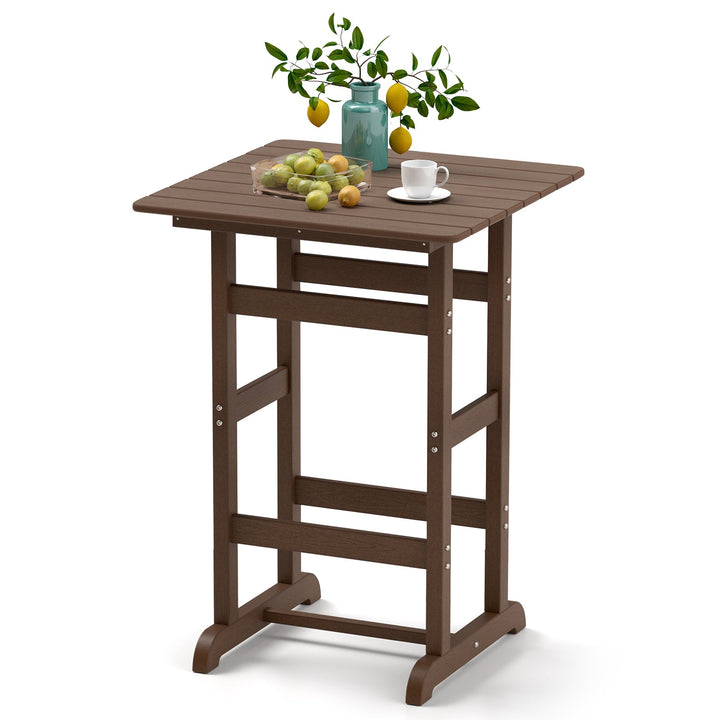 Brown square bar table with slatted top and decorative items on surface