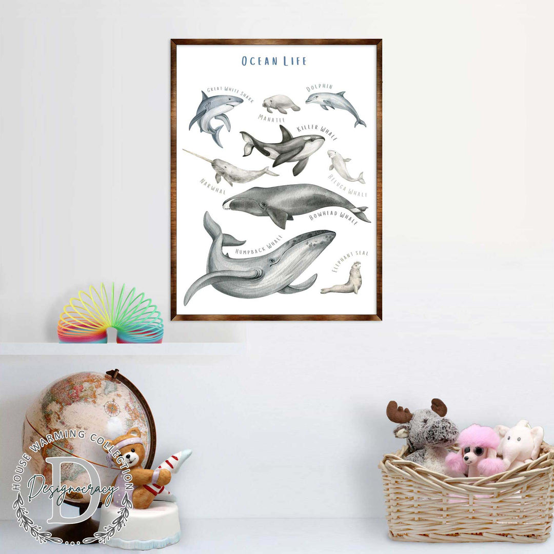 Wood-framed ocean life poster with illustrated whales, dolphins, and sea lions