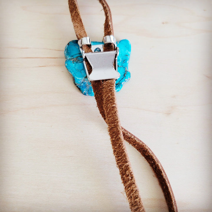 Blue stone slab pendant with silver square clasp on brown leather lariat cords